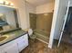 Vintage bathroom features a single sink vanity, toilet, and tiled shower-tub combination at 2787 Heritage Ln, Morrow, GA 30260