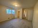 Bedroom with closet space, neutral walls, and carpet, bathed in natural light from a window at 2787 Heritage Ln, Morrow, GA 30260