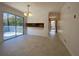 Bright dining area features modern light fixture, tile floor, and sliding glass doors to the outdoor deck at 2787 Heritage Ln, Morrow, GA 30260