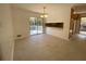 Bright dining area features modern light fixture, tile floor, and sliding glass doors to the outdoor deck at 2787 Heritage Ln, Morrow, GA 30260