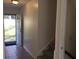 The tiled foyer has the stairs to one side, and an exterior door that welcomes the outside in at 2787 Heritage Ln, Morrow, GA 30260