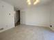 Spacious living room with tiled floor, and a door to the side and stairs to the upper level at 2787 Heritage Ln, Morrow, GA 30260