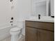 Bathroom with a tub and shower combo, tiled walls, and modern fixtures at 729 Keystone Dr, Woodstock, GA 30188