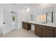 Spacious bathroom featuring double vanities, modern fixtures, and ample lighting at 729 Keystone Dr, Woodstock, GA 30188