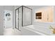 Modern bathroom showcasing a soaking tub, walk-in shower, and bright window at 729 Keystone Dr, Woodstock, GA 30188