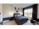 Cozy bedroom features a bed with storage, dark grey decor, and window at 729 Keystone Dr, Woodstock, GA 30188