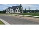 New construction home with manicured lawn near the community pool and playground at 729 Keystone Dr, Woodstock, GA 30188