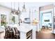 Modern kitchen with white cabinetry, a large island with seating, and stainless steel appliances at 729 Keystone Dr, Woodstock, GA 30188
