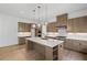 Modern kitchen features custom cabinets, a large island with quartz countertop, and stainless steel appliances at 729 Keystone Dr, Woodstock, GA 30188