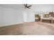 Open-concept living space with hardwood floors, a kitchen island, custom cabinets, and ample natural light at 729 Keystone Dr, Woodstock, GA 30188