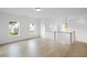 Open loft space with natural light and hardwood floors at 729 Keystone Dr, Woodstock, GA 30188