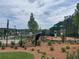 Community playground with slides, climbing structures, and play areas for children at 729 Keystone Dr, Woodstock, GA 30188