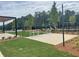 Community playground featuring picnic tables and a play structure, surrounded by lush greenery at 729 Keystone Dr, Woodstock, GA 30188