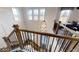 Beautiful staircase featuring wooden railings and iron spindles at 729 Keystone Dr, Woodstock, GA 30188