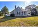 Charming single-Gathering home with a welcoming front porch and well-maintained lawn and landscaping at 4409 Shiloh Rd, Loganville, GA 30052
