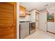 Laundry room with washer, dryer, and built-in shelving at 3483 Princeton Corners Dr, Marietta, GA 30062