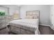 Bright bedroom with neutral paint, plush carpet, a window, and a matching bedroom set including a bed and dresser at 6427 Grey Fox Way, Riverdale, GA 30296