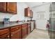 Functional kitchen featuring wood cabinets, stainless steel appliances, and ample counter space at 6427 Grey Fox Way, Riverdale, GA 30296