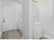 Convenient laundry area with washer, dryer, and half bathroom with a white vanity at 6427 Grey Fox Way, Riverdale, GA 30296