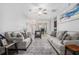 Bright and airy living room with stylish furnishings, open layout, and a view to dining area at 6427 Grey Fox Way, Riverdale, GA 30296
