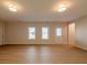 Finished basement with hardwood floors and multiple windows at 112 Redford Ln, Canton, GA 30115