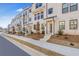 Row of townhouses with light brick and landscaping at 260 Wilder Ridge Way, Lawrenceville, GA 30044