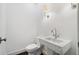 Modern half-bath with marble sink and toilet at 420 Argonne Nw Dr, Atlanta, GA 30305