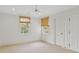 Bedroom with neutral walls, carpet, woven window shades, and a ceiling fan at 420 Argonne Nw Dr, Atlanta, GA 30305