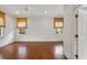 Spacious bedroom with hardwood floors, ceiling fan and natural light coming through the two windows at 420 Argonne Nw Dr, Atlanta, GA 30305