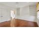 Bedroom with hardwood floors, built-in shelving, and a doorway leading to another room at 420 Argonne Nw Dr, Atlanta, GA 30305
