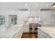 Spacious kitchen with white marble countertops, white cabinets, and stainless steel stove at 420 Argonne Nw Dr, Atlanta, GA 30305