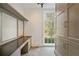 Bright office space with built-in desk, custom cabinets, and large window at 420 Argonne Nw Dr, Atlanta, GA 30305