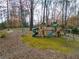Backyard with a large wooden playset featuring slides, swings, and climbing structures for endless fun at 420 Argonne Nw Dr, Atlanta, GA 30305