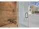 Shower with stone walls, a built-in bench, and a glass door at 420 Argonne Nw Dr, Atlanta, GA 30305