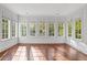 Sunroom with hardwood floors and an abundance of natural light from multiple windows at 420 Argonne Nw Dr, Atlanta, GA 30305