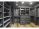 Spacious walk-in closet features dark gray shelving, drawers, and unique carpeting at 420 Argonne Nw Dr, Atlanta, GA 30305