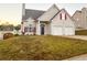 Charming two-story home with a two-car garage, arched entryway, and well-maintained lawn at 137 St Ann Cir, Dallas, GA 30157