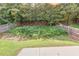 Backyard with lawn and wooden fence, offering privacy at 363 Lobdale Falls Dr, Lawrenceville, GA 30045