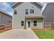 Backyard featuring a patio, grassy area, and neutral siding at 363 Lobdale Falls Dr, Lawrenceville, GA 30045