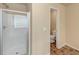 Bathroom features a glass-enclosed shower, and a private toilet room for added convenience and privacy at 363 Lobdale Falls Dr, Lawrenceville, GA 30045
