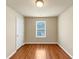 A bedroom with hardwood floors and a window at 363 Lobdale Falls Dr, Lawrenceville, GA 30045