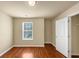 A bedroom with hardwood floors and a window at 363 Lobdale Falls Dr, Lawrenceville, GA 30045