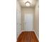 The entryway has clean lines, a light fixture, and wood-look flooring at 363 Lobdale Falls Dr, Lawrenceville, GA 30045