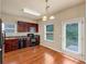 An eat-in kitchen with wooden cabinets, stainless steel appliances, and hardwood floors at 363 Lobdale Falls Dr, Lawrenceville, GA 30045