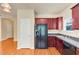 A kitchen featuring stainless steel appliances, wooden cabinets, and hardwood floors at 363 Lobdale Falls Dr, Lawrenceville, GA 30045