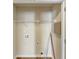 Practical laundry room with shelving, utility connections, and ample space for organizing household chores at 363 Lobdale Falls Dr, Lawrenceville, GA 30045