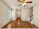 Open-plan living room featuring wood floors and access to the second story staircase at 363 Lobdale Falls Dr, Lawrenceville, GA 30045