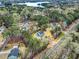 Stunning aerial view of homes nestled among lush trees with a picturesque lake in the background at 3745 Pilgrim Mill Rd, Cumming, GA 30041