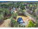 Aerial view of a neighborhood street, showcasing a lovely home with a driveway and green lawn area at 3745 Pilgrim Mill Rd, Cumming, GA 30041