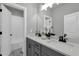 Bathroom with a double vanity, modern fixtures, and tiled shower/tub, offering a stylish and functional space at 3745 Pilgrim Mill Rd, Cumming, GA 30041